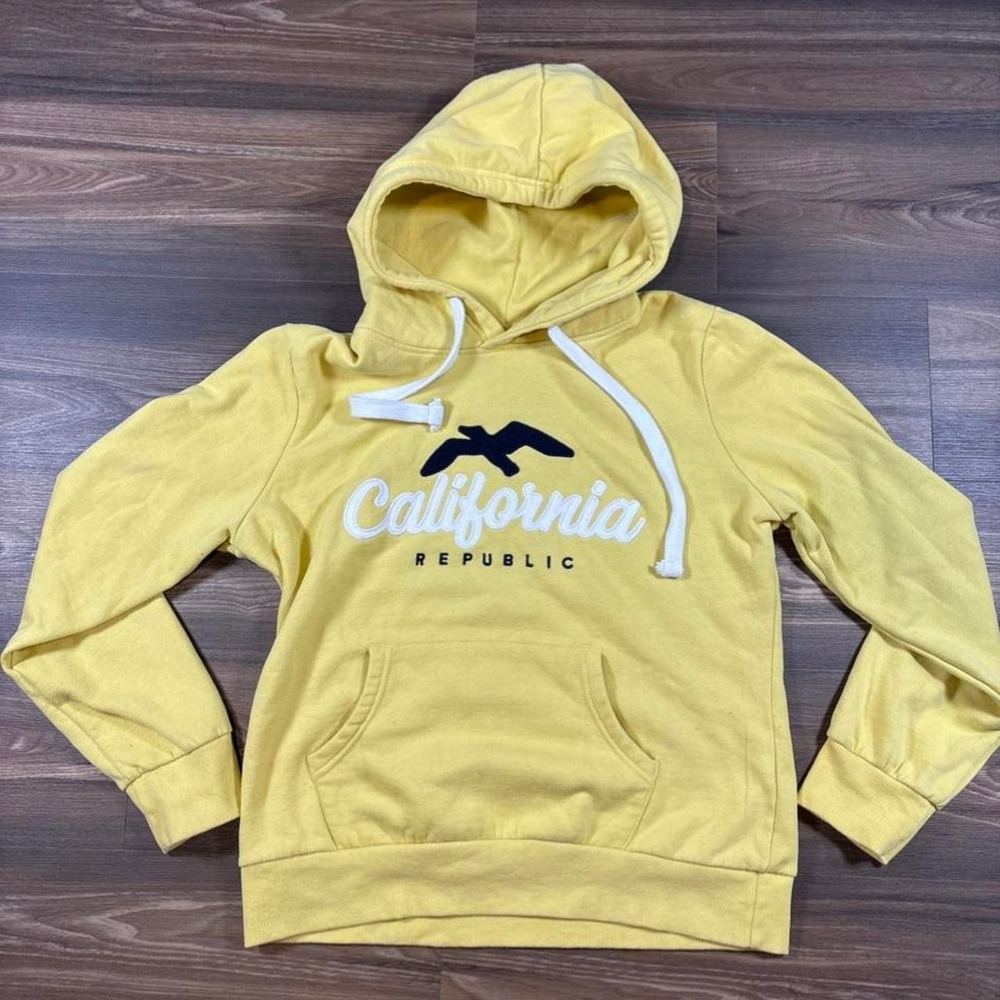 Yellow Reflex California Republic hoodie with white text and black bird graphic